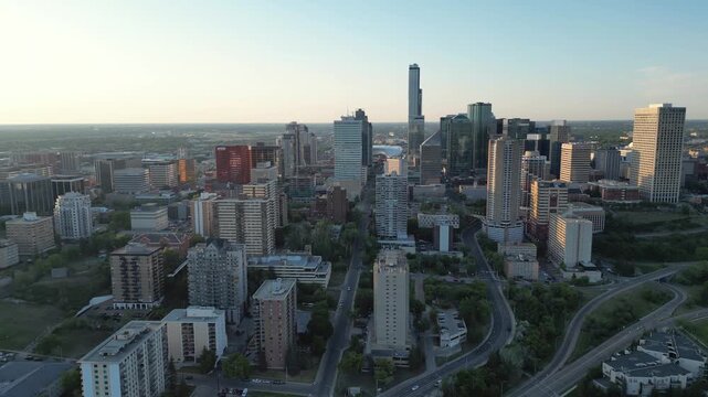 Downtown Edmonton, Alberta Skyline Aerial at Sunset with Golden Hour Light, River Valley Silhouettes, and Modern Canadian Cityscape