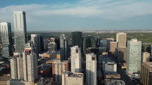 Aerial Skyline View of Downtown Edmonton, Alberta at Golden Hour Sunset with Warm Light, River Valley Silhouette, and Modern Urban Architecture