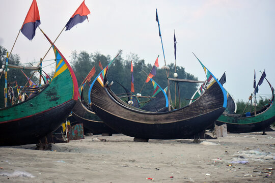 Moon Boat at Cox&rsquo;s Bazar Beach, Bangladesh. A traditional moon-shaped fishing boat resting along the shoreline of Cox&rsquo;s Bazar, Bangladesh.