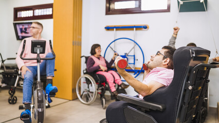 Diverse group of people with disability training in a rehabilitation center gym, focusing on physical therapy and inclusive fitness