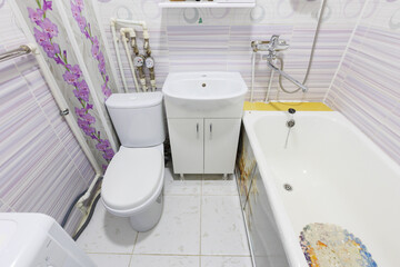 modern bathroom room with toilet and washing machine