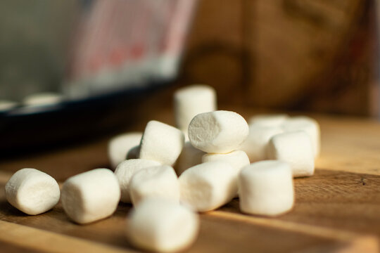 Marshmallows on a wooden board.
