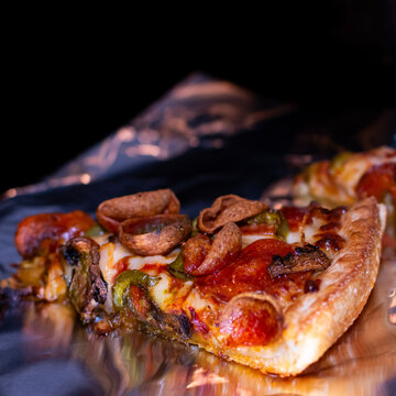 Side view of pizza reheating in the oven. 