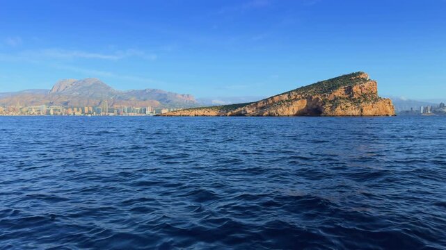 Benidorm Island and city skyline from boat Costa Blanca Spain