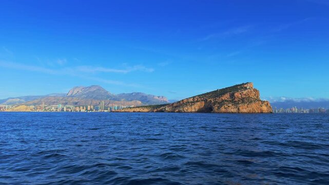 Benidorm Island and city skyline from boat Costa Blanca Spain