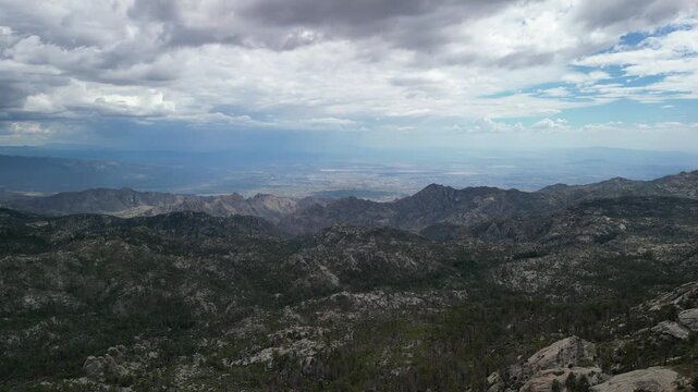 Aerial view of the rocky mountain landscape at Mount Lemmon near Tucson in Arizona distant hills under cloudy sky and desert high-elevation terrain