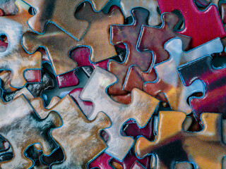 Background of scattered colorful puzzle pieces