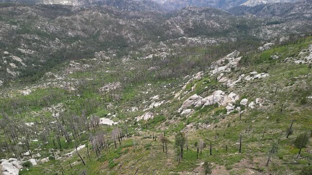 Aerial view of hillside terrain and scattered mountain homes near Mount Lemmon above Tucson, Arizona, rocky landscape and desert mountain scenery