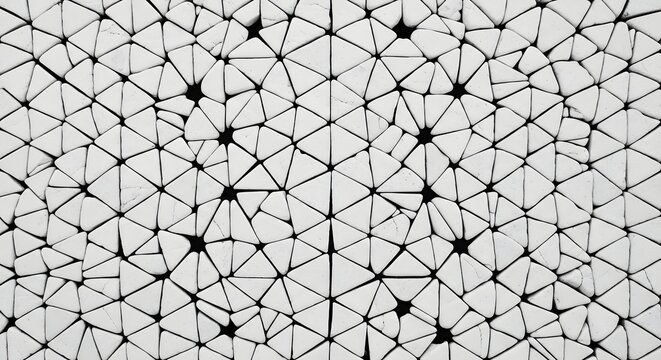 A close up view of a damaged glass surface with a cracked and shattered texture