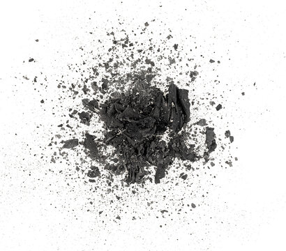 Pieces of burnt paper isolated on a white background, top view. The ashes of the paper. Charred paper scraps.