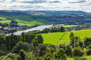Obraz premium River Tay winding through Scottish valley landscape