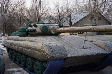 Naklejka premium Almaty, Kazakhstan - 01.20.2026 : Inflatable imitation of military equipment, to deceive the enemy. A false target.