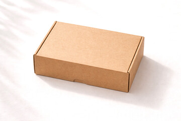 Brown cardboard box mockup on a clean minimalist background. Versatile packaging scene ideal for branding, e-commerce, logistics and sustainable product presentations.