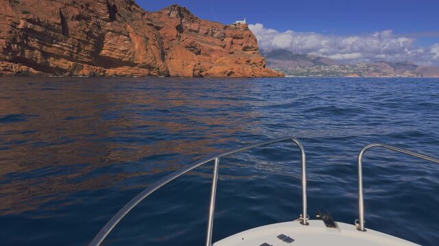 Altea boat cruising near Albir lighthouse Serra Gelada Costa Blanca
