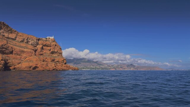 Altea boat cruising near Albir lighthouse Serra Gelada Costa Blanca