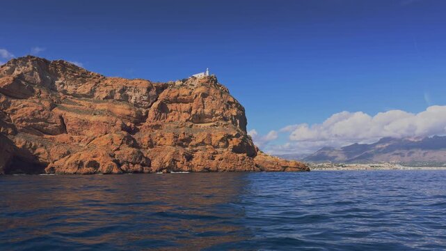 Altea boat cruising near Albir lighthouse Serra Gelada Costa Blanca