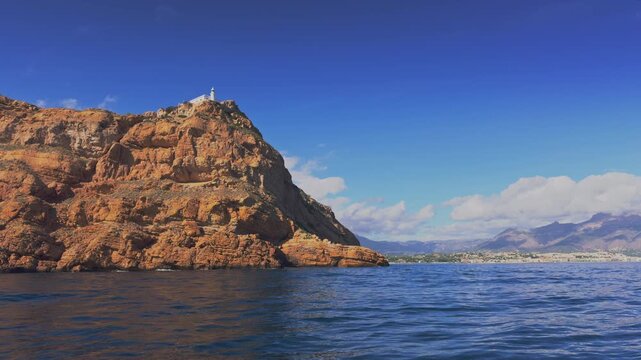 Altea boat cruising near Albir lighthouse Serra Gelada Costa Blanca
