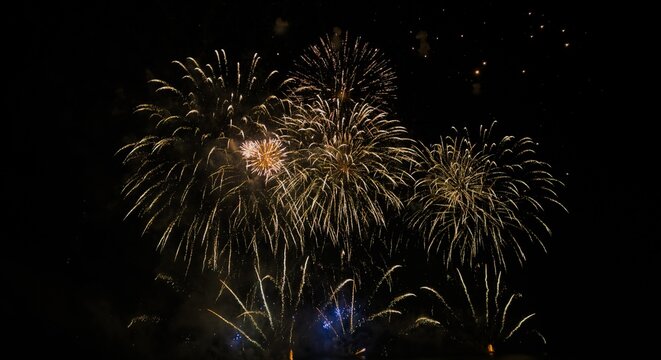 Colorful fireworks over cityscape at new year night