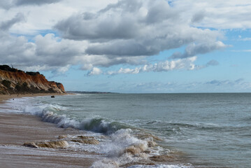 Barranco Beach, Algarve, amazing desert beach between cliffs in southern Portugal with incredible blue water