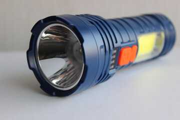 LED spotlight and yellow LED for illumination in one backpacking flashlight
