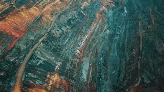 Iron ore mining, mineral deposits, excavation work, drone view.