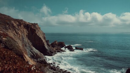 Fototapeta premium Coastal cliffside view of ocean and sky