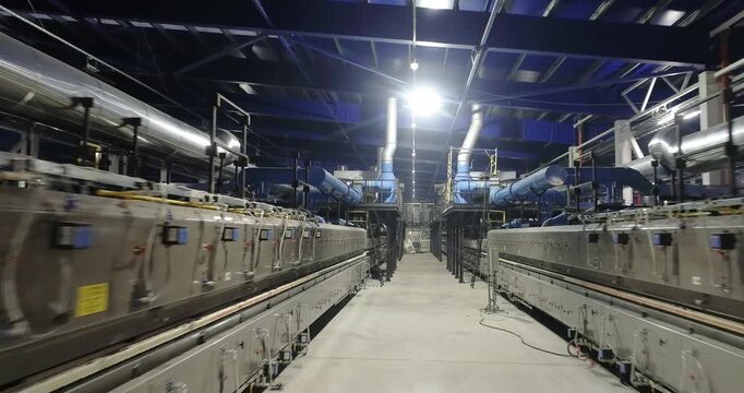  Industrial kilns or tunnel furnace for Firing Ceramic Tiles. Industrial drying for ceramics. Roller Kiln for the Production of Ceramic Tiles. Production line of a ceramic and porcelain tile factory. 