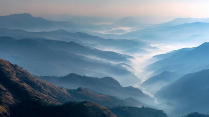 Fototapeta premium A serene mountain landscape with misty valleys and rolling hills at sunrise