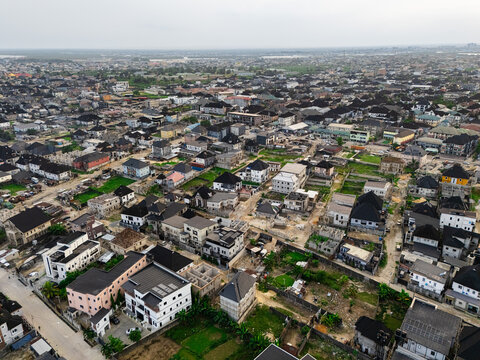 Aerial view of a residential area with buildings and greenery, showcasing a blend of urban and natural elements, Port Harcourt, Rivers, Nigeria.