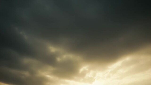 Golden light filtering through a blanket of soft, fluffy clouds creating an atmospheric, ethereal background with varied tones and textures, conveying a sense of serenity