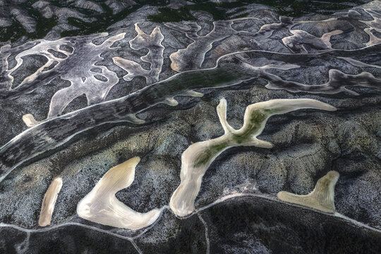 Aerial view of contrasting textures and patterns of land and sand create an abstract landscape, Villamayor de Gallego, Zaragoza, Spain.