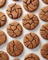 Fototapeta premium Freshly baked cookies arranged in a neat pattern on a white surface ready for serving during a holiday gathering or family event