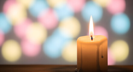 Candle on Pastel Bokeh Background