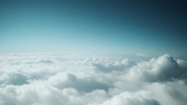 Billowing white clouds spread across the boundless horizon. Creating a serene and ethereal landscape under the clear. Vibrant blue sky. Symbolizing freedom and tranquility during an atmospheric flight