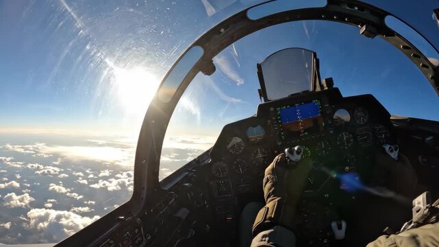 Cockpit view fighter jet sunrise above cloud with pilot hands on controls flight instruments