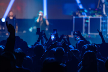 Person Recording Concert On Smartphone