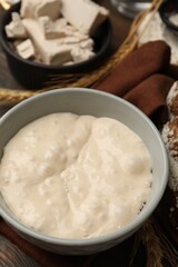Fototapeta premium Yeast dough and ingredients on wooden table, closeup