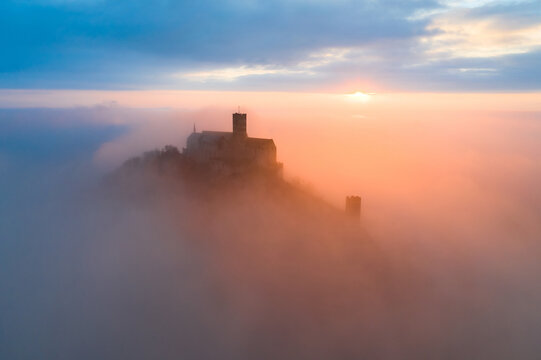 Castle in the Clouds. Foggy morning over Bezdez castle. Czech Republic
