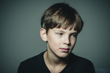 Obraz premium portrait of a dissatisfied and tired boy
