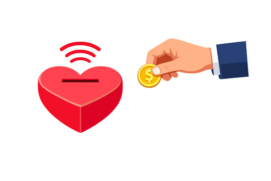 Hand placing coin into heart shape box in a digital donation concept for charity or fundraising from a distance using mobile technology