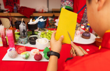 Chinese New Year candle workshop - create traditional festive symbols and Chinese characters from red paper. Cultural craft activity celebrating Lunar New Year traditions