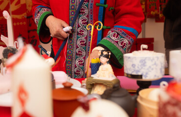 Chinese New Year candle workshop - create traditional festive symbols and Chinese characters from red paper. Cultural craft activity celebrating Lunar New Year traditions