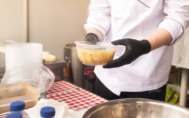 Traditional Chinese noodles at the fair. Lunar New Year parade, Asian community. Festive atmosphere, cultural diversity. Ideal for travel, culture, festival promotion and editorial design