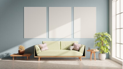 living room features a green sofa with cushions, a wooden table beside it, and three empty frames...