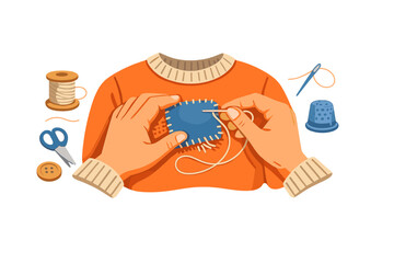 Person mending a torn orange sweater with blue fabric patch and needle at a table with sewing tools