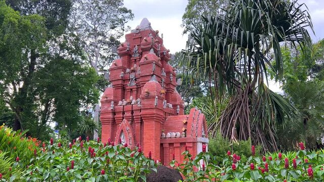 Vietnam, September 9, 2025: Tao Dan City Park in Ho Chi Minh City, behind the Independence Palace. A miniature of the Cham Tower. Alleys and green spaces. Well-maintained grounds and flower beds. 4К