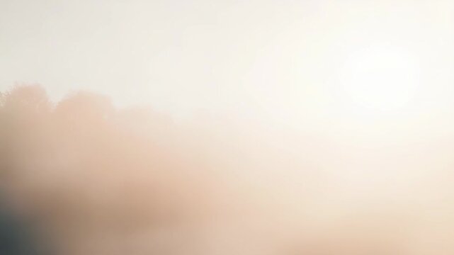 Abstract gradient background with warm, soft light filtering through atmospheric haze, creating a gentle bokeh effect and blurred outlines suggesting a natural landscape