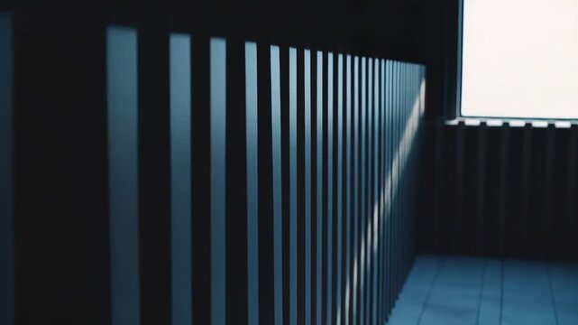 Sunlight creates strong geometric stripes of light and shadow across a modern tiled floor, representing concepts of hope, freedom, and structured pathways in architecture