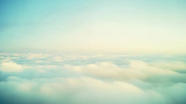 Dreamy abstract view from airplane window, showing soft white cumulus clouds floating in a serene sky with a gentle color gradient, creating a tranquil atmosphere