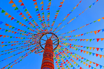 Maslenitsa holiday, decorative ethnic pattern, multicolored triangular flags